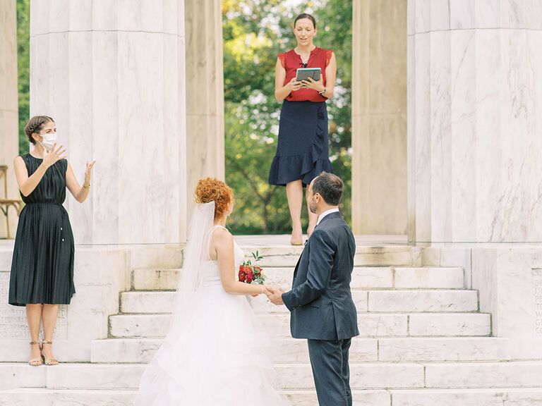ASL interpreter signing during wedding ceremony