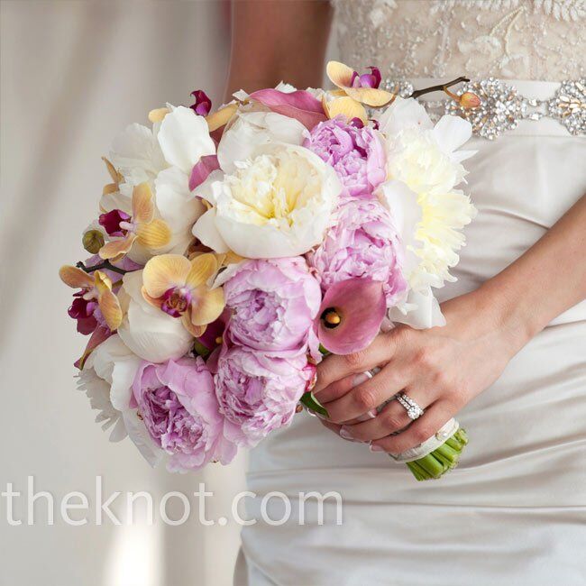 Gold and magenta orchids made Cara’s lush bouquet  of popular springtime flowers (peonies and  calla lilies) stand out.