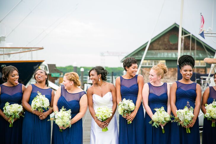 Shayna went for a classic, timeless look when it came to her bridesmaids’ wedding day attire, choosing a floor-length navy chiffon gown with an illusion neckline from David’s Bridal for all of the girls. They completed the look with silver heels for a touch of subtle glitz and knot bangles gifted to them by Shayna.