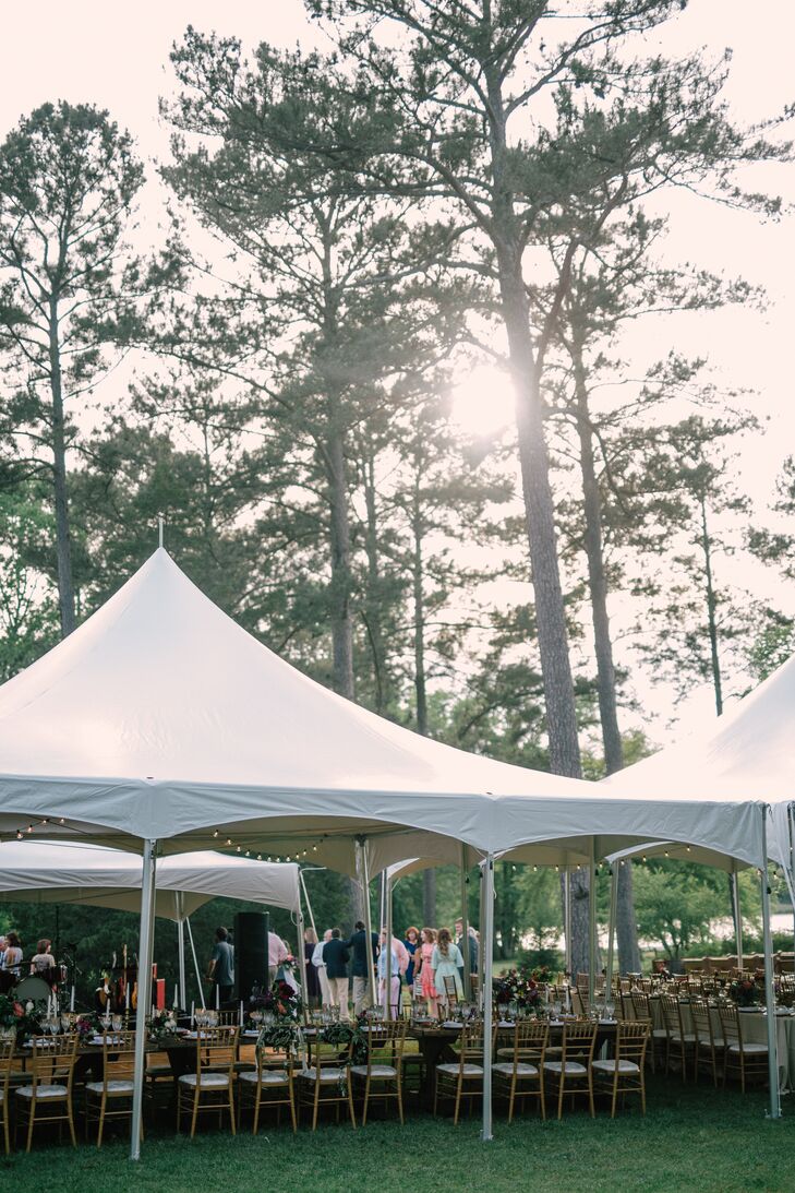 Just a short walk from the ceremony, the reception tent provided some shade for the alfresco reception at Diastole Farms in Concord, Georgia. Guests enjoyed a seated meal before dancing the night away.