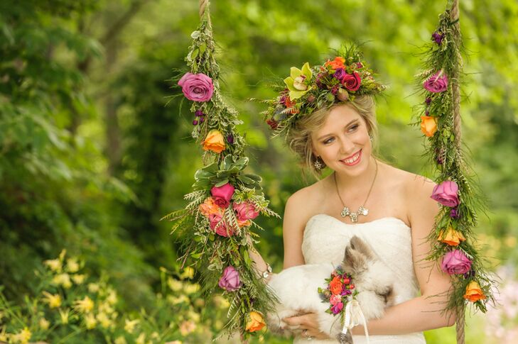 Chelish Moore Flowers created a lush flower crown from bright red roses, green orchids and various types of greenery for the bride. Paired with her loose, romantic updo, the crown added a bohemian touch to her look.