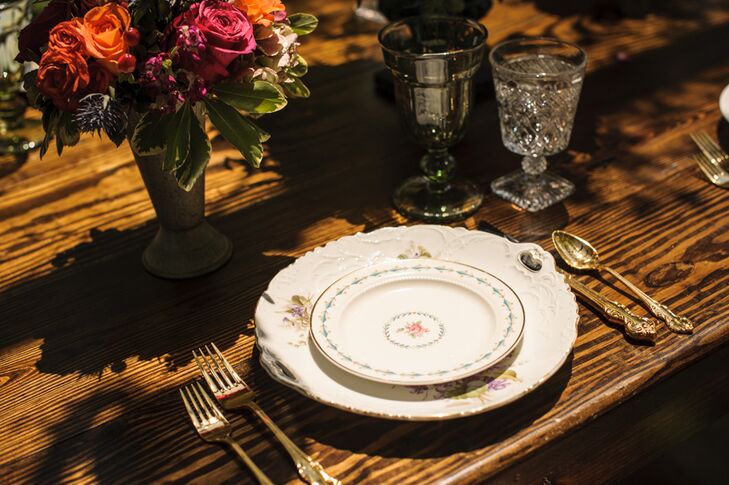 For a dainty, feminine touch, Heirloom for Hire provided vintage floral dinnerware, which Simply Styled stacked at each place setting alongside brass cutlery and etched glasses.