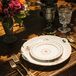 For a dainty, feminine touch, Heirloom for Hire provided vintage floral dinnerware, which Simply Styled stacked at each place setting alongside brass cutlery and etched glasses.