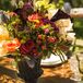 The tables were marked by quaint table numbers featuring illustrated mason jars and dainty hand-drawn flowers created by the designers at Dazzle & Delight.