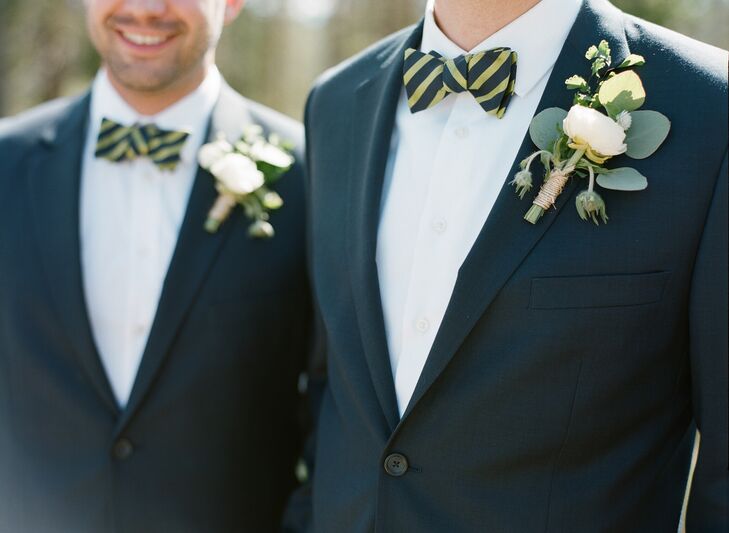Alex and his groomsmen accessorized their navy suits with olive green striped bow ties from Ted Baker London.