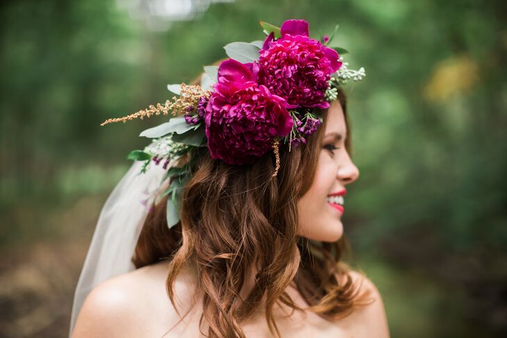 Andi wore her hair down in soft, loose waves and completed the look with a statement flower crown featuring her special peonies.