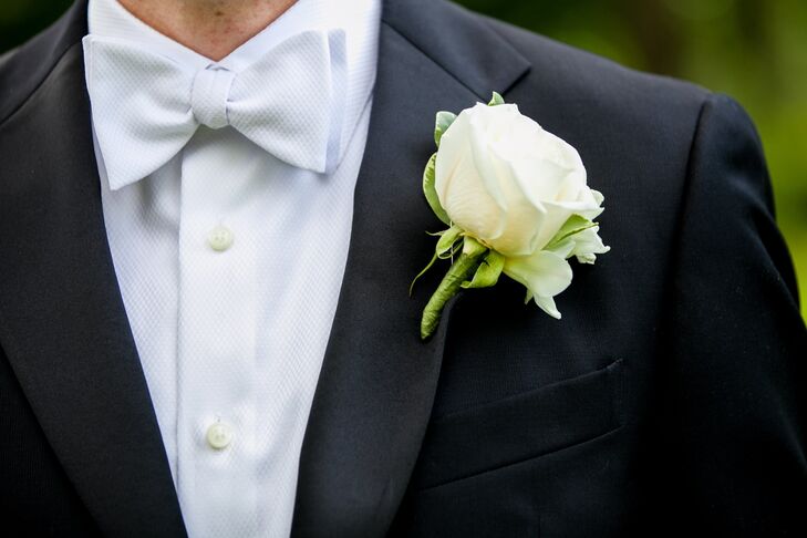 Mark's boutonniere featured one large white rose. It looked sharp against his dark tuxedo.
