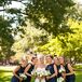 Maggie's five bridesmaids donned sophisticated navy blue dresses with open backs. They also wore different necklaces from designer Erin McDermott.