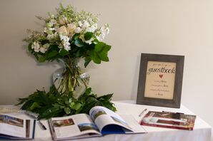 Reception Welcome Table with Floral and Frame Decor