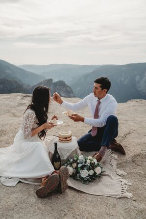 Couple Eating Cake During Elopement at Glacier Point in Yosemite National Park