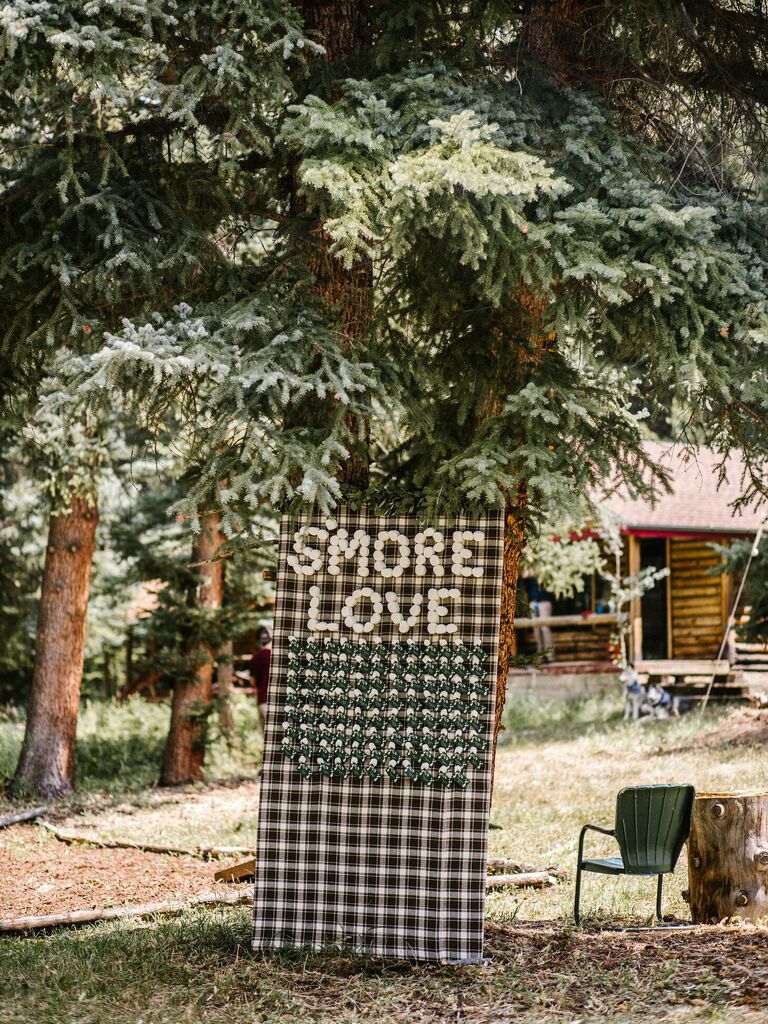 S'more escort card display at mountain wedding