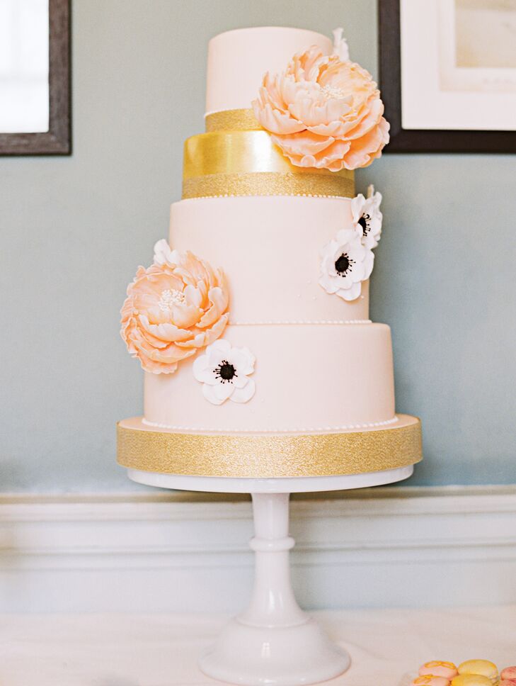 Gilded layers and handmade sugar flowers tied the four-tier pink and gold confection in with the rest of the day's decor.