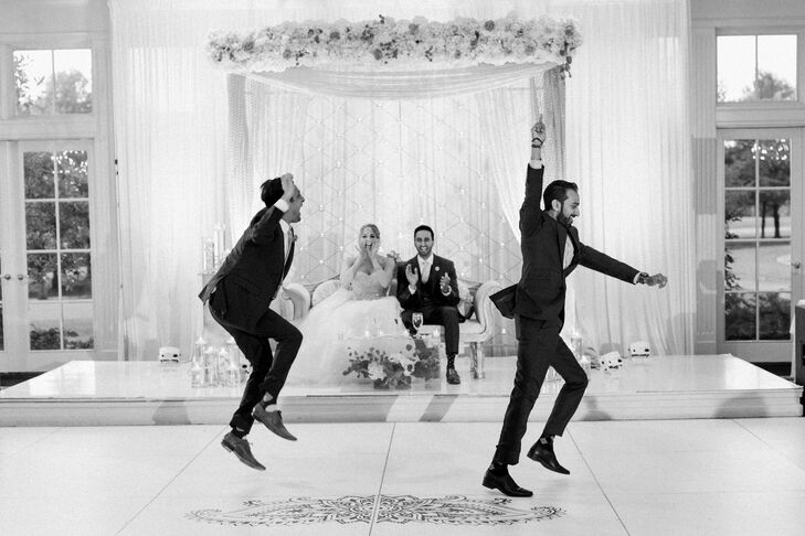 At the Hindu reception, the newlyweds sat on a slightly elevated white couch that overlooked the dance floor—prime seating as the night went on.