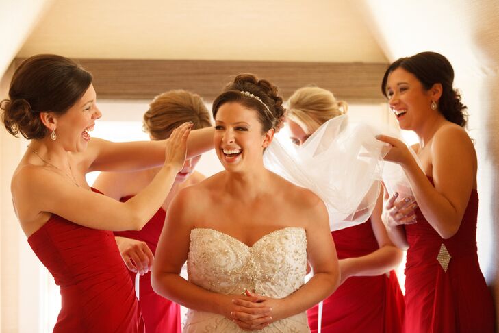 “The bridesmaid dresses were cranberry red chiffon with a small sparkle detail near the left hip which complemented Karen's dress perfectly,” says Kirk. “They chose their own silver dress shoes, and received silver and pearl matching necklaces and earring sets from the bride.”