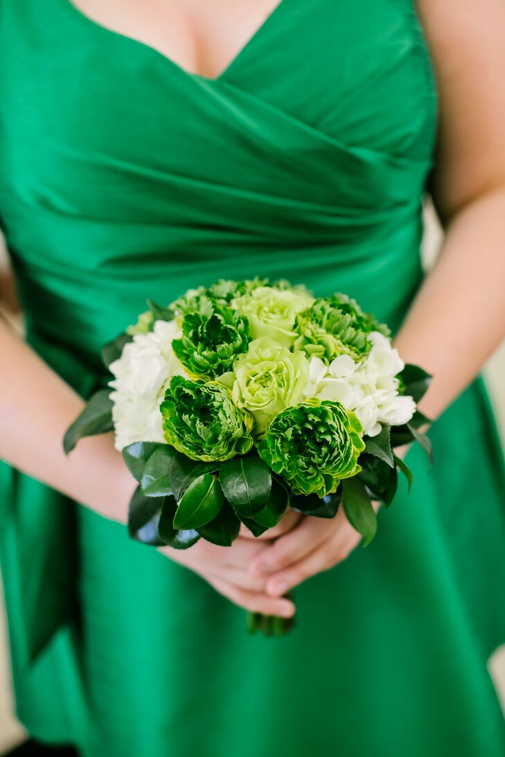 Bridesmaids matched their emerald green dresses with emerald green bouquets mixed with accents of white.
