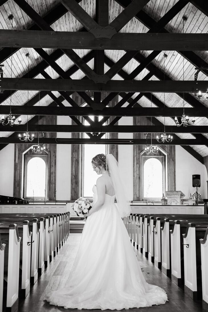 The two got married at The Woods Chapel in Orono, Minnesota and took a lot of shots in the rustic chapel space, including this bridal portrait.