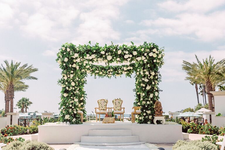 Dramatic mandap with lush greenery