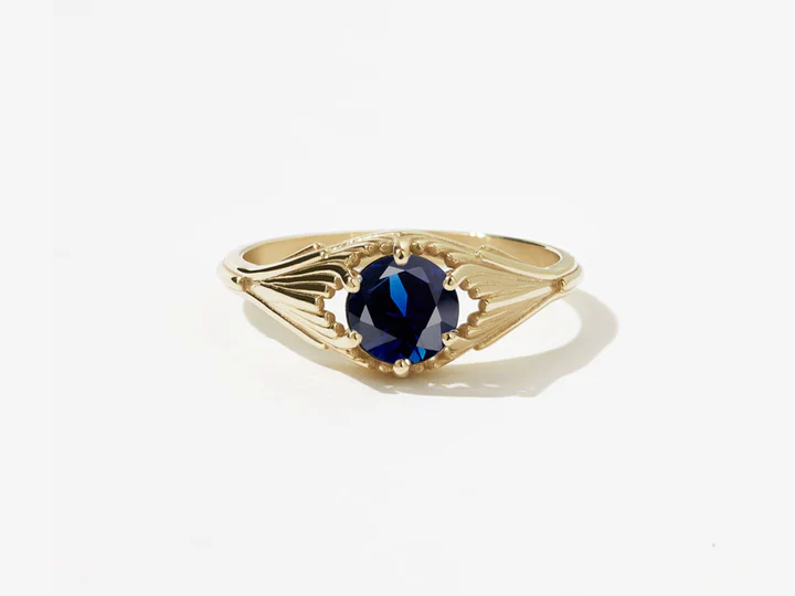 A vintage-inspired yellow-gold sapphire ring.