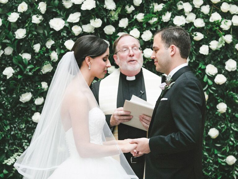 bride and groom and officiant at wedding ceremony