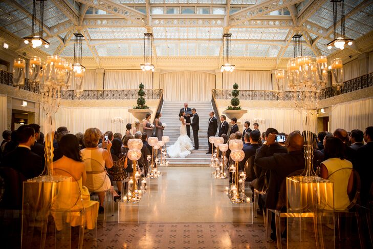 Emily and Tyler immediately fell in love with the Rookery—a historic landmark in the heart of Chicago's financial district—from the moment they set foot inside the building. "We held our wedding in the light court, which features white marble and wrought-iron staircases," Emily says. "We wanted to incorporate as much of our venue into our design as possible."
