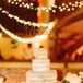 Lexi and Jeff enjoyed a four-tiered naked funfetti cake for their wedding. They loved the birthday-cake look and the bronze-wire “We do” cake topper. The cake perfectly complemented the rustic barn venue while still adding their own twist on tradition.