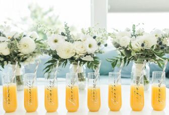 mimosas in champagne glasses customized with bridesmaids names 