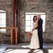 Groom Embracing Bride in Loft