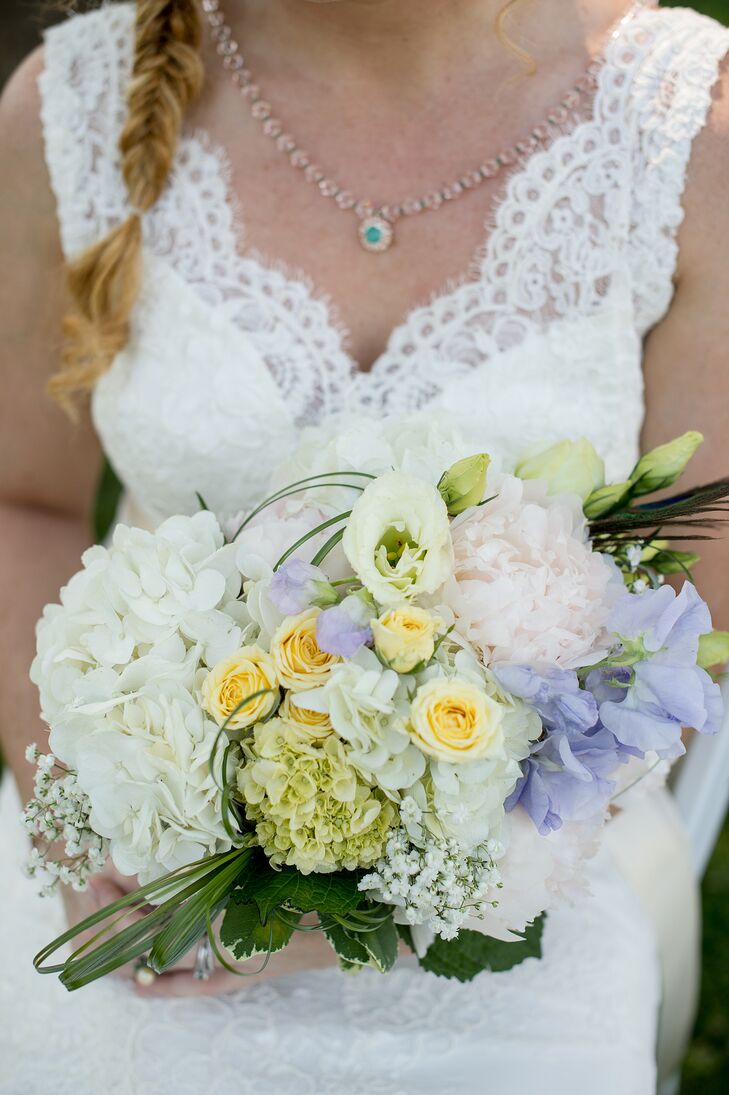 Meagan carried a bridal bouquet with white hydrangeas, blush peonies, viburnum and pale yellow spray roses. This pastel arrangement meshed well with the wedding’s navy and white color palette. Floral design at the wedding was provided by Cache Fleur, a florist based out of Edgewater, Maryland.