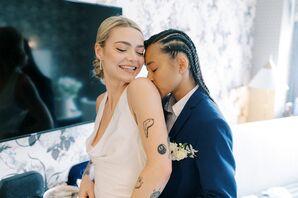 LGBTQ+ Couple in a Deep Blue Suit and a Modern, Cowl-Neck, Dress and Low Bun