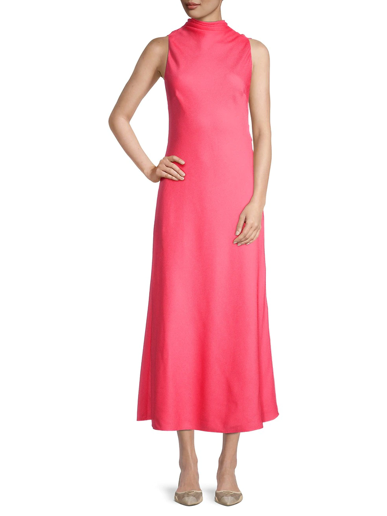 A model shows off this sleeveness gown with a mid-calf length hem.