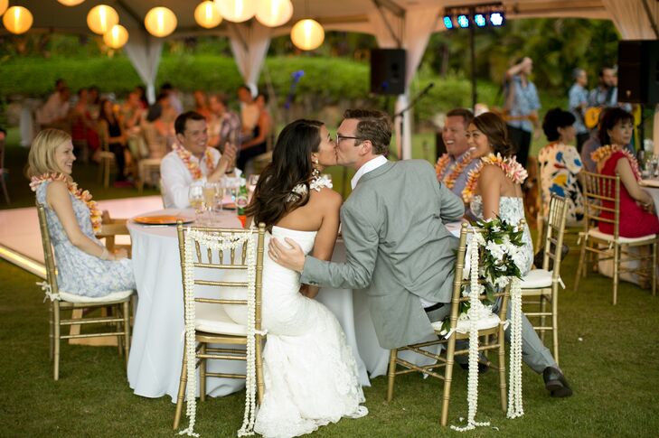 Couple Kissing at Sweetheart Table