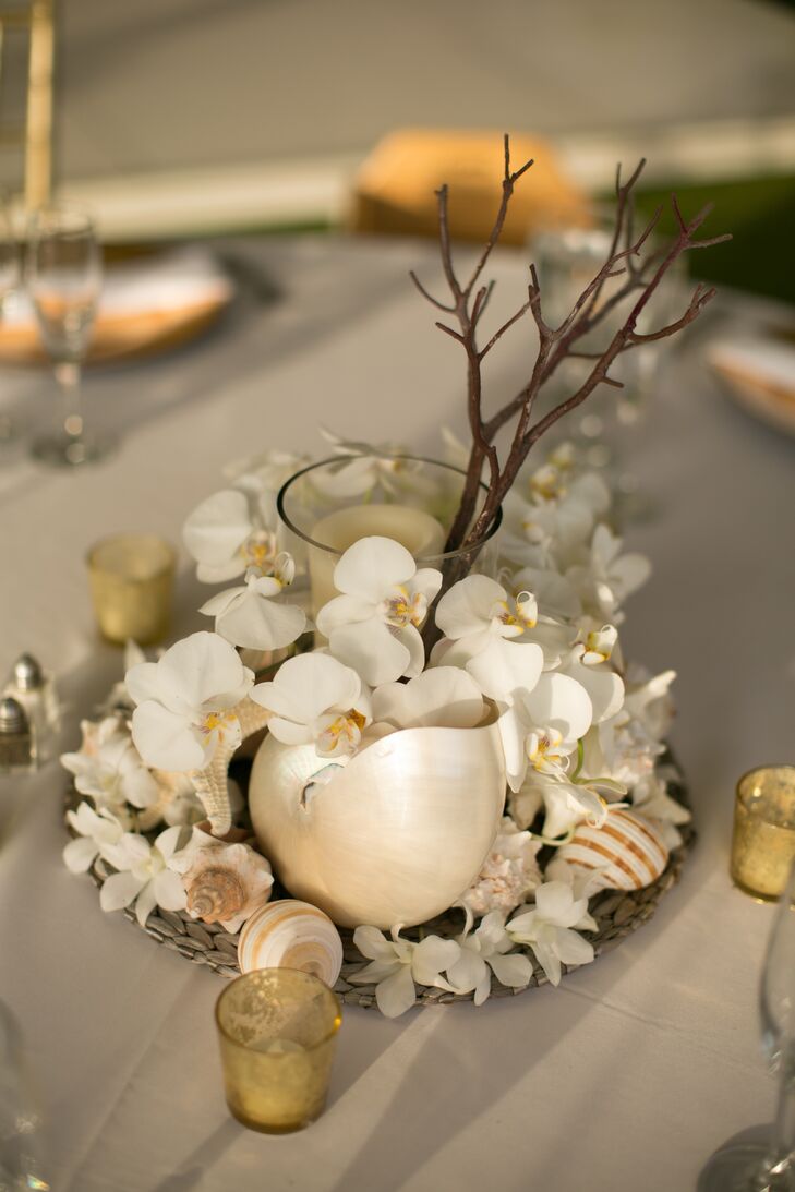 rn“We had white, gold and coral as our color palette,” Evelyn says. “We wanted simple colors that would be complimented by the venue's landscape, and wanted everything to look beautiful, island-like and romantic. rn