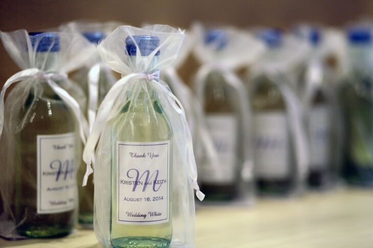 Kristen and Keith sent guests home with miniature personalized wine bottles. Guests under 21 left with a bag of the couples' favorite candies.