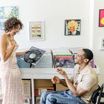 Wedding proposal in vinyl record music store