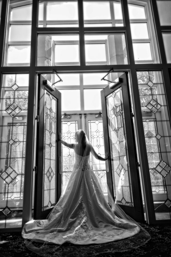 "My wedding dress is the perfect cross between a ballgown and an A-line dress," says Leslie. "It was diamond white satin and heavily beaded with silver thread and a sweetheart neckline."