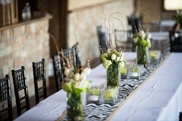 To go with the spring season, Shannon and Tom brightened up Fishermen’s Inn with a vibrant color palette of green apple, navy and white. Wild Orchid created fresh arrangements of tulips, curly willow, green hydrangeas and pussy willow to bring the room to life, while Shannon’s mother handcrafted all of the table runners with eye-catching chevron prints and rustic burlap fabric, a detail that reflected the wedding’s contemporary and rustic undertones.