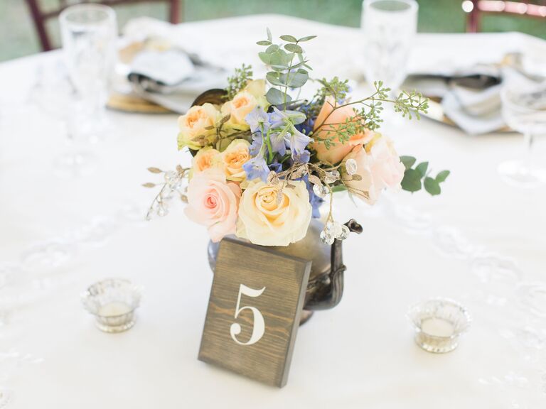 A floral teapot centerpiece.