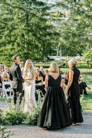 Couple at Alfresco Altar With Pastel Floral Semi-Circle, Mothers in Black Gowns Speech During Ceremony