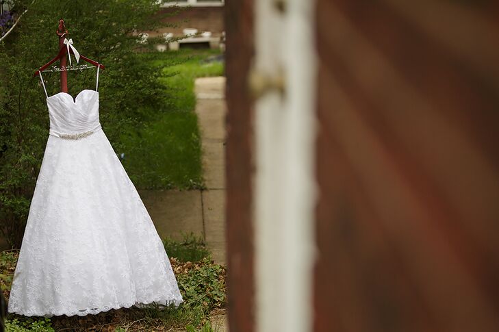 Erin wore a Mori Lee lace dress with a crystal belt. The A-line gown was strapless with a sweetheart neckline.