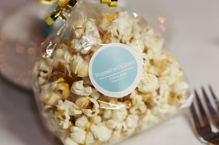 The caramel popcorn favors were popped by Erin and her mother. The bags were labeled with a "Popped with Love" tag and tied with a gold ribbon.