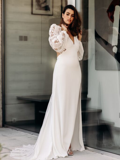 Bride wears a wedding dress by French designer Sophie Sarfati. 
