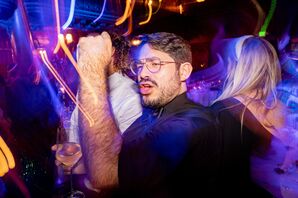 Guests Dancing on Dark Dance Floor With Flare Effects