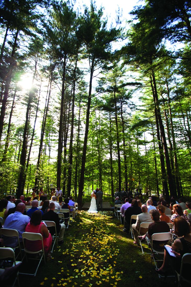 Amy and Eric wed in a romantic outdoor ceremony surrounded by tall trees.