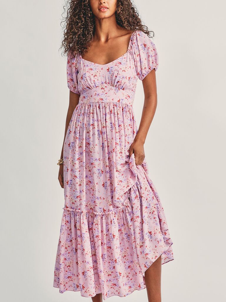 love shack fancy pink and purple floral garden wedding bridesmaid dress with short sleeves