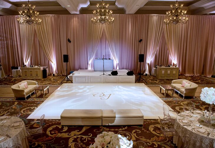 "As part of the branding of our wedding, we had a custom monogram made for us, an 'S & J.' This could be found on our invitations, menus, signs and more. It was also part of the focal point of the reception room: the dance floor," Sarah says. "Our dance floor had a white vinyl wrap, and in the center was our monogram in metallic silver."
