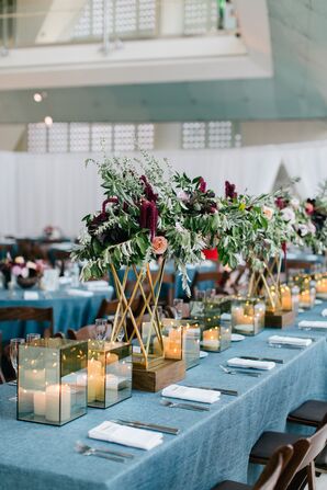 Reception Tables with Blue Linens, Candles and Tall Floral Centerpieces