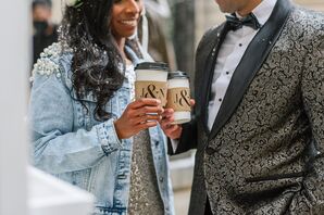 Bride and Groom Holding Coffee Cups With Custom Coffee Cup Sleeves