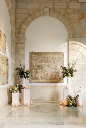 Ceremony Space in Art Museum With Columns, Flowers and Lit Candles