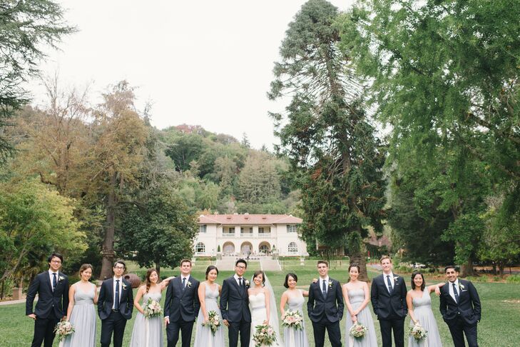 Jauchy's bridesmaids wore pale, slate blue gowns, and Jeffrey's groomsmen sported navy J.Crew suits.