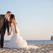 Maria wore a mermaid-style wedding dress at her beach wedding—how fitting! The Pronovias gown featured an elaborate ruffled skirt with a chapel-length train.